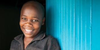 a boy from Kenya smiling