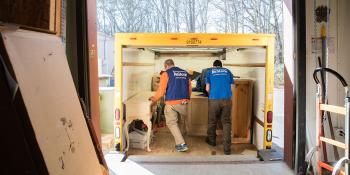 Habitat volunteers loading furniture donations into truck