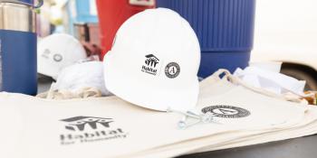 close-up of Habitat AmeriCorps tool belts and hard hat.