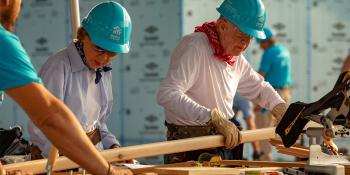 President and Mrs. Carter on the build site.