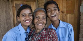 Grandmother with her twin grandchildren in Nepal.