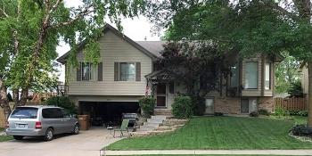 Peggy's house with an American flag hanging by the front door