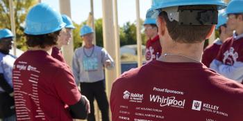 Volunteers on a Habitat build site with shirts that say Whirlpool