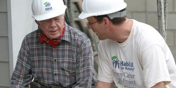 President Jimmy Carter sitting with Habitat CEO Jonathan Reckford