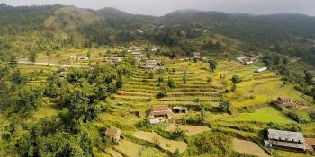 Houses stand on a terraced mountainside in Nepal