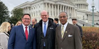 Three men in stand in front of the U.S. Capitol. From left to right, Mike Flood, Jonathan Reckford and Emanuel Cleaver.