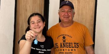 A man and his daughter inside a house