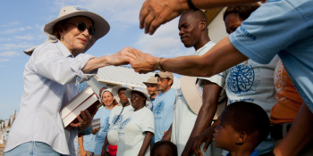 Rosalynn Carter shaking hands with volunteers.
