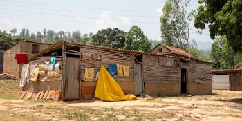 A photo of a wooden slat house.