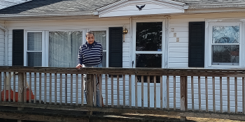 A homeowner on the front porch of her white house in Franklin County, Virginia.