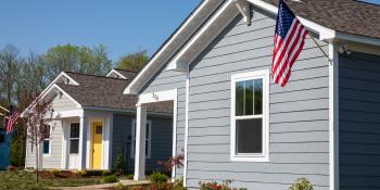 Habitat houses with an American flag. 