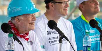 Former President Jimmy Carter and Jonathan Reckford speaking at a press conference at the 2018 Carter Work Project.