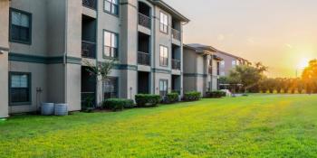 two-story apartment building and green lawn