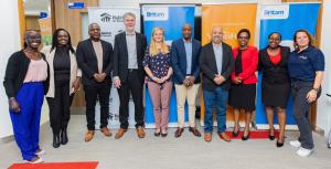 Group photo of Britam, VisionFund Kenya, Habitat for Humanity at the partnership signing