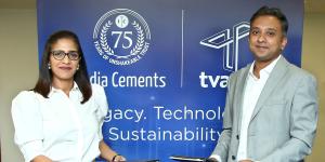 A man and woman in business clothes pose