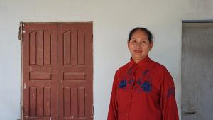 Cambodian homeowner Sophal outside her home in Kandal province, Cambodia