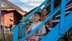 Rem(R) and daughter Sonika outside their home in Siem Reap, Cambodia