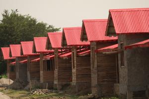 Line of cement bamboo frame homes with red roofs