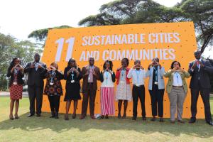 Habitat for Humanity delegation to the UN Habitat Assembly pictured showing the house sign.
