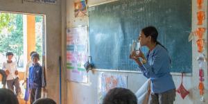 Teacher in a classroom teaching students