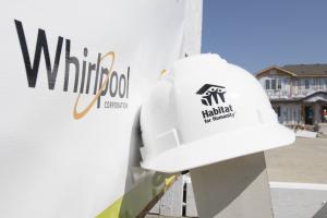 Sign and hard hat on build site