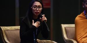 Mardee speaking at an event.