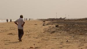 People walking on the beach in southeastern India after 2004 tsunami hit