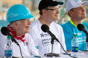 Former President Jimmy Carter and Jonathan Reckford speaking at a press conference at the 2018 Carter Work Project.