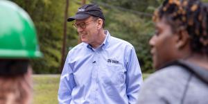 Habitat CEO Jonathan Reckford smiling with volunteers.