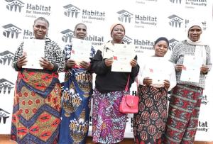Families displaying their titles in Zambia.jpg