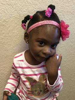 little girl with pink bow