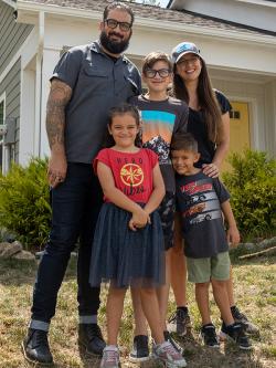 Family of five in front of their Habitat home.