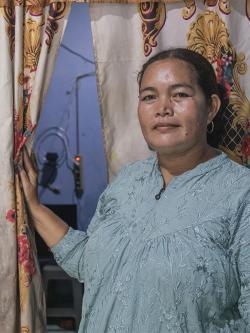 Komariyah inside her rental home in Tanjung Kait, Indonesia
