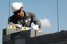 Volunteer laying block