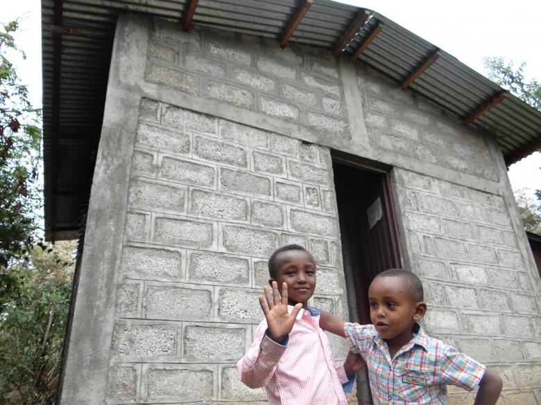 Children by the communal toilet