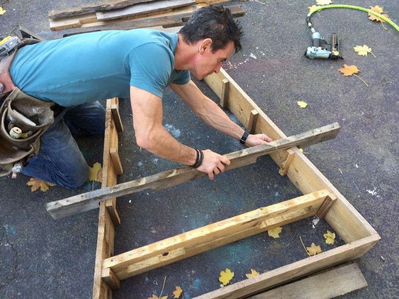 Attaching cleats to hold the shelves of a pallet Christmas tree