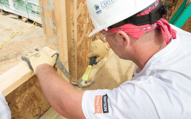 Man working on Habitat construction site.