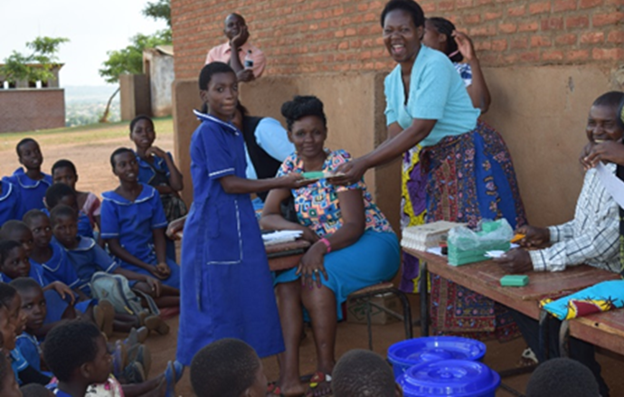 Schoolgirls-receiving-prizes-after-quiz-was-conducted-on-sanitation-and-hygiene