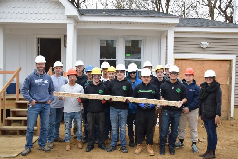 Students in William Floyd High School’s carpentry program help build a Habitat house.