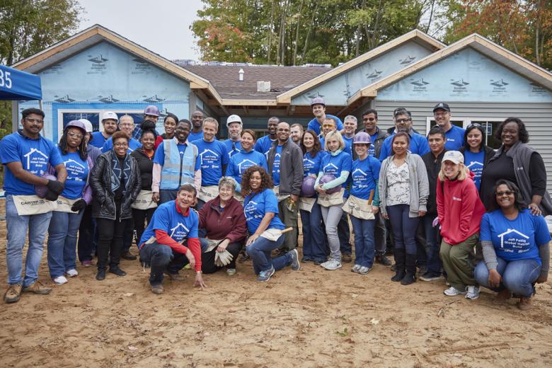 group photo on build site with Whirlpool employees