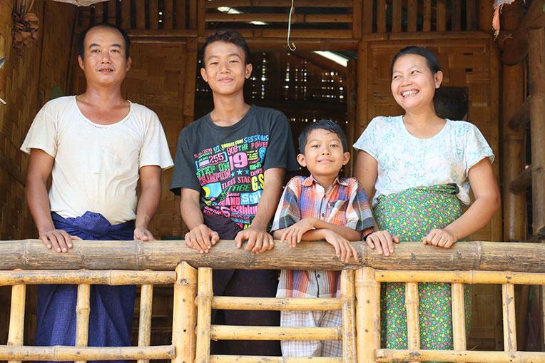 U Aung Aung Oo and his family on the veranda of their Habitat home in Myanmar