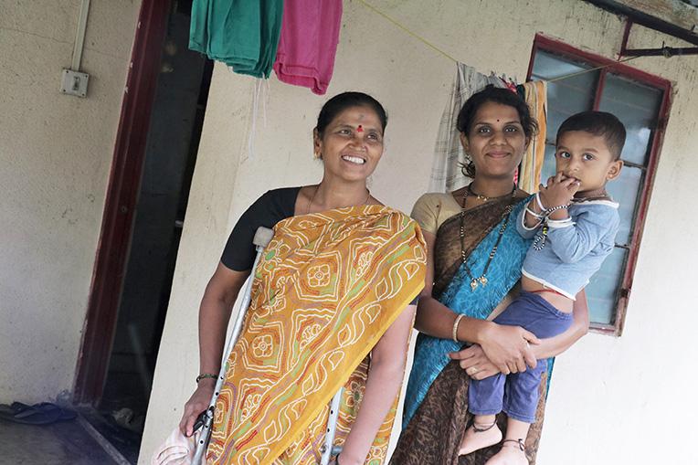 Lata (left) with her neighbor and the latter's son. Lata was among 100 families who built their homes during 2006 Carter Work Project in Lonavala, India.