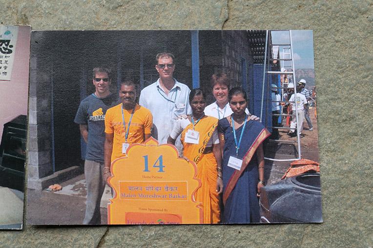 Malan (third from right) in a photo taken with Habitat volunteers during the 2006 Carter Work Project. Her husband Moreshwar (second from left) and her daughter Surekha (right) also worked on their home. Photos: Habitat for Humanity India/Rutuja Powle.