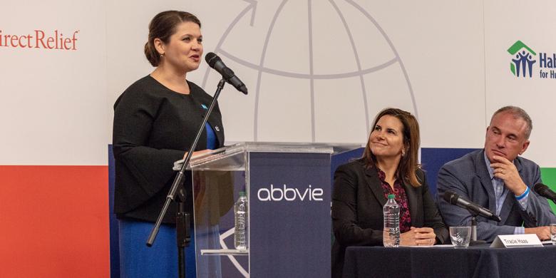 Habitat Hammers Back director Desiree Bartosiak speaks at an event in San Juan.