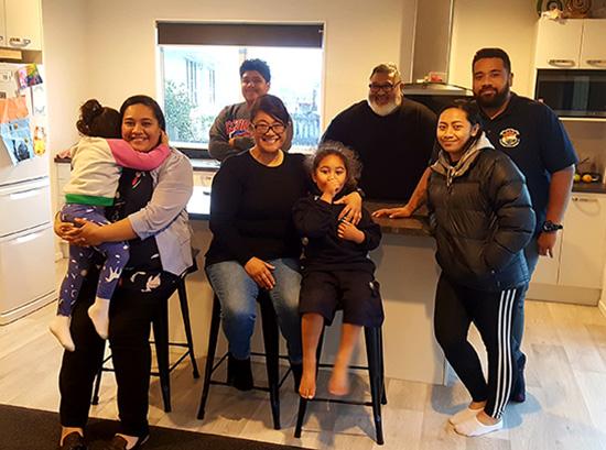 Allan's and Alice's family inside their Habitat home in Otara, New Zealand.