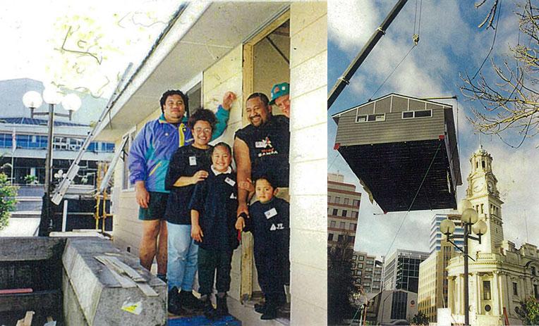 The family (left) at the build in the town square that saw the house (right) being moved to its current location. 