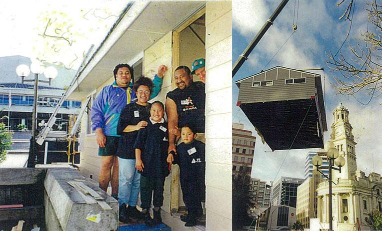 The family (left) at the build in the town square that saw the house (right) being moved to its current location.