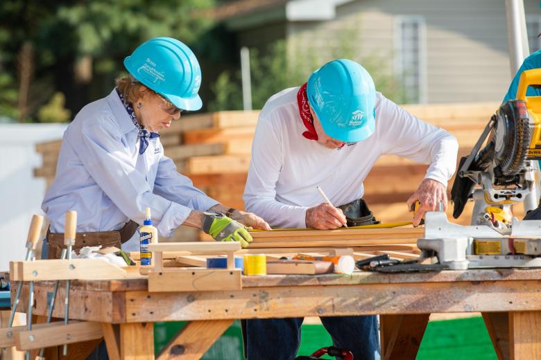 Jimmy and Rosalynn Carter on the Carter Work Project build site in 2018.