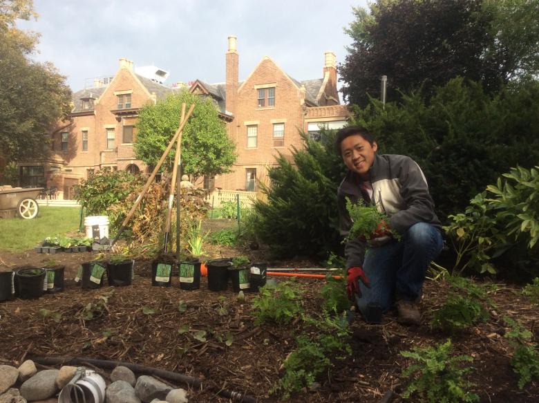 Steven Yang smiling in his garden.