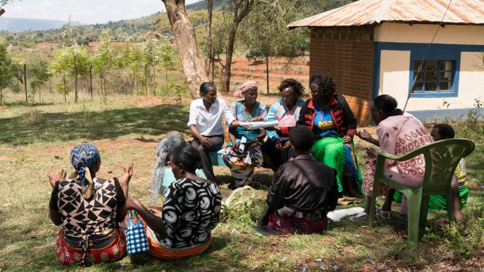 A women’s group discusses loans under the guidance of a KWFT officer in Kyangala, Kenya